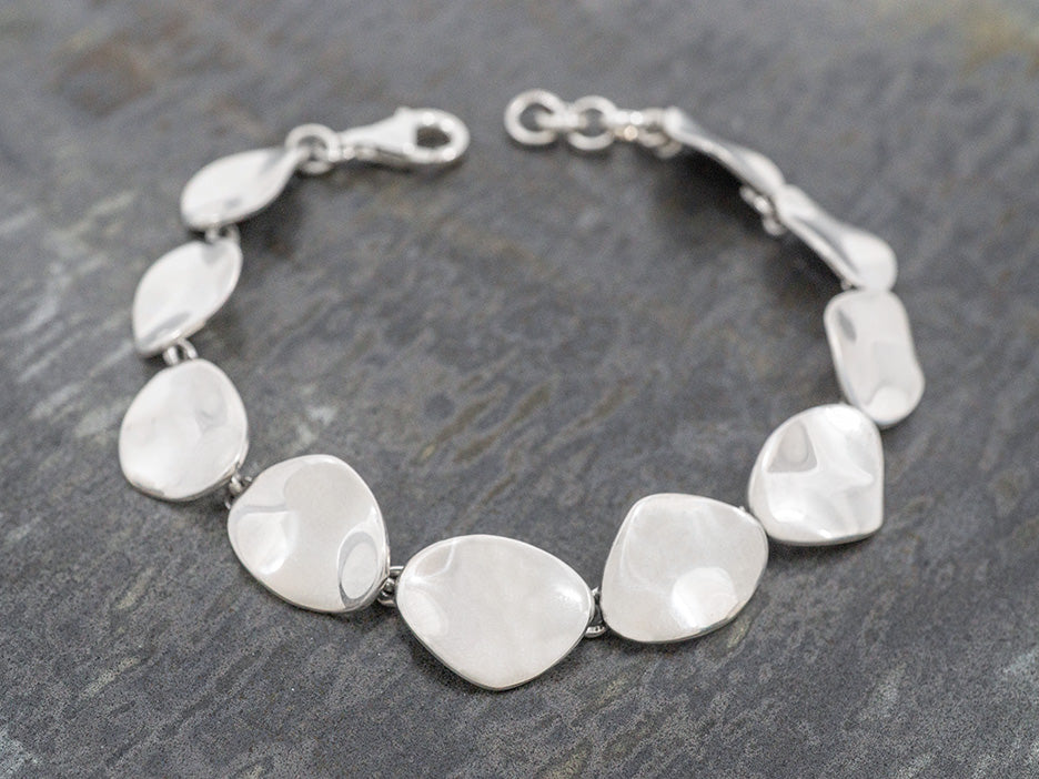 A sterling silver bracelet with wavy links.
