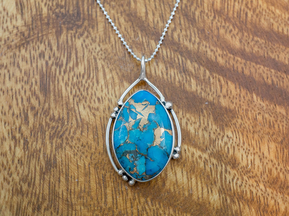 Bronzed Turquoise Pendant in Asymmetrical Frame