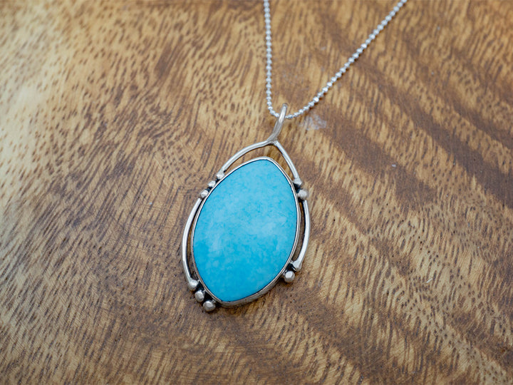 Turquoise Pendant in Asymmetrical Frame