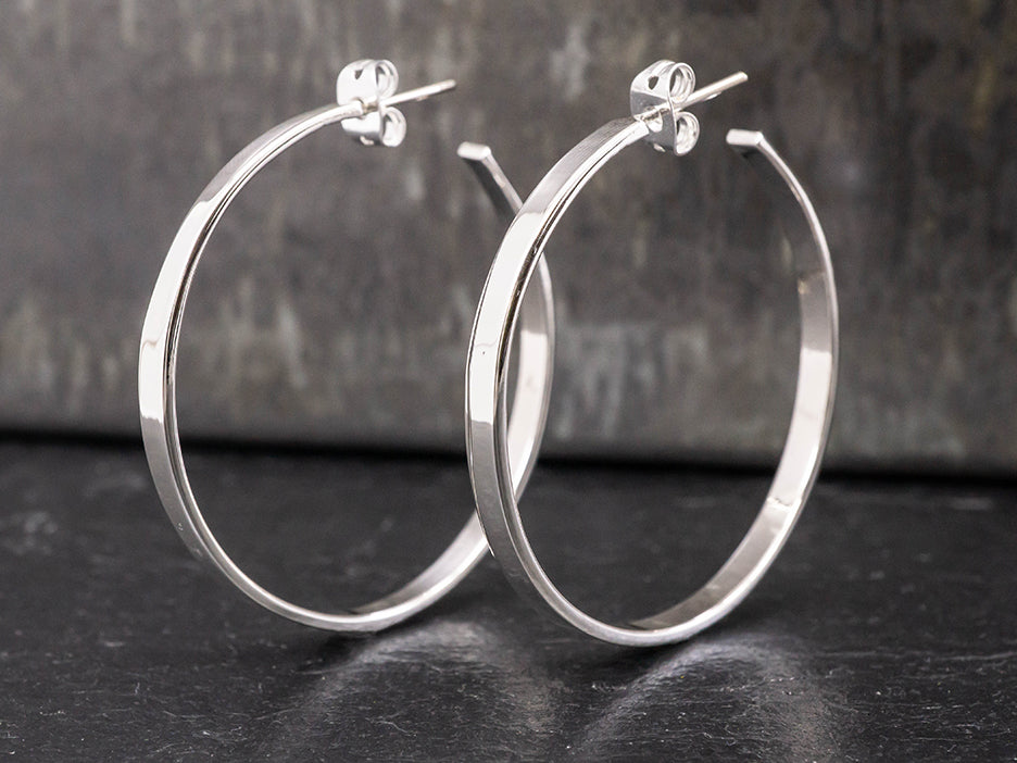 Sterling silver hoop earrings.
