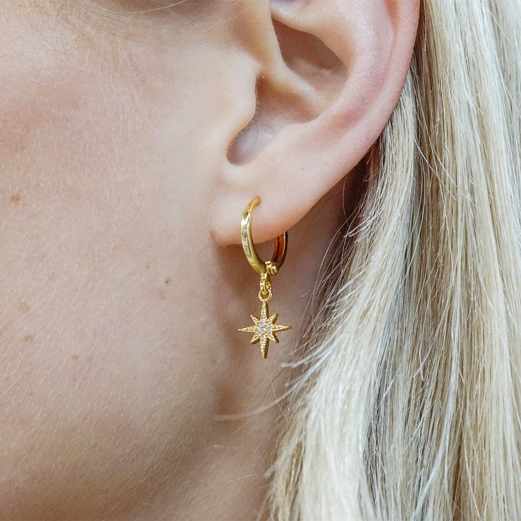 Yellow Gold-filled huggie earring with a pave-style star charm.