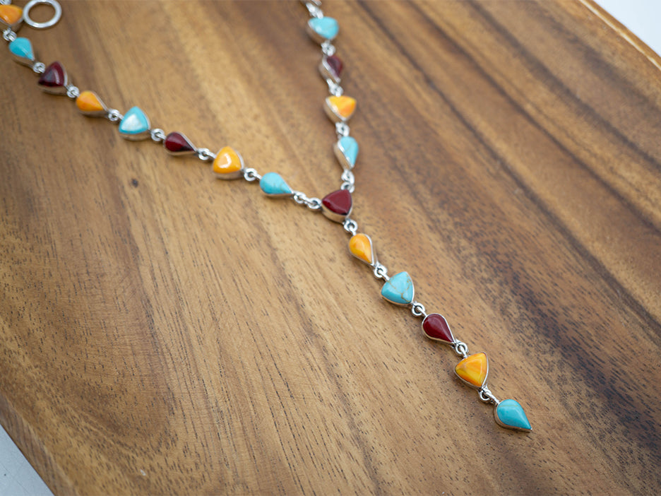 18" sterling silver lariat with yellow, red and turquoise stones.