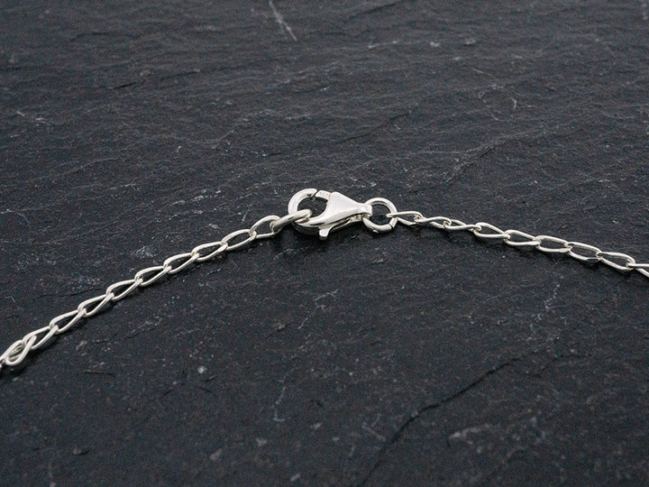 Sterling silver lariat necklace with an 8" drop and pendulum dangle.