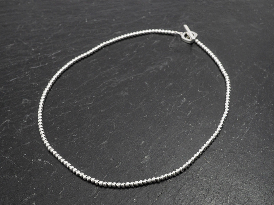 16" sterling silver beaded necklace with a decorative toggle closure.
