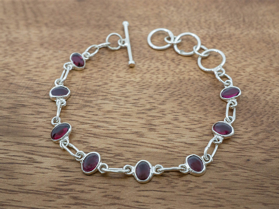 sterling silver bracelet with garnet ovals