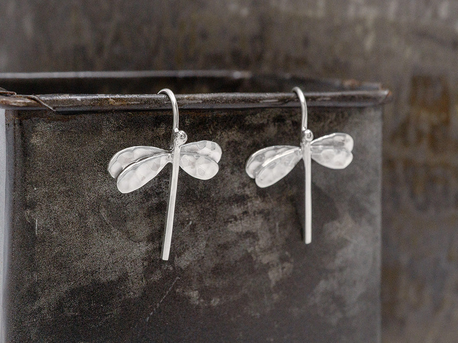 Sterling silver dragonfly earrings on a fixed hook. The wings are hammered. 