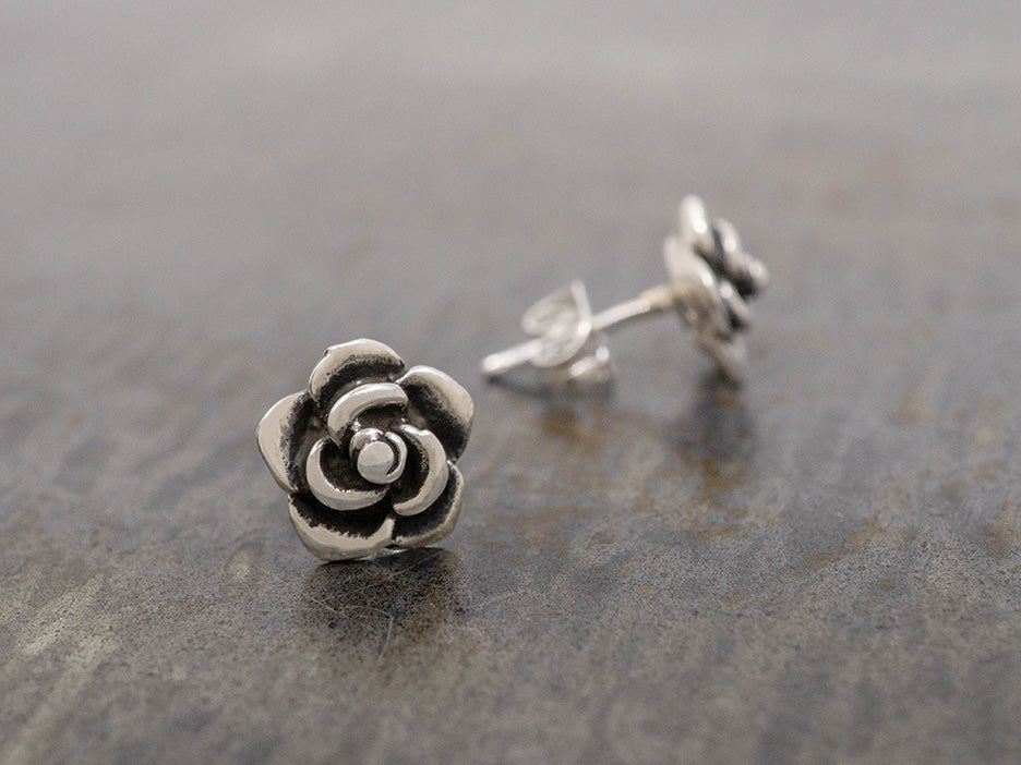 Sterling silver flower earrings with oxidized details.