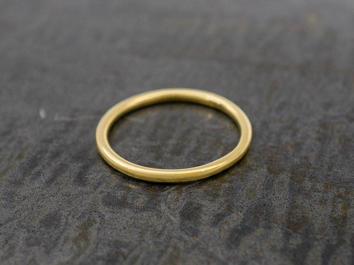 A simple, dainty gold ring.