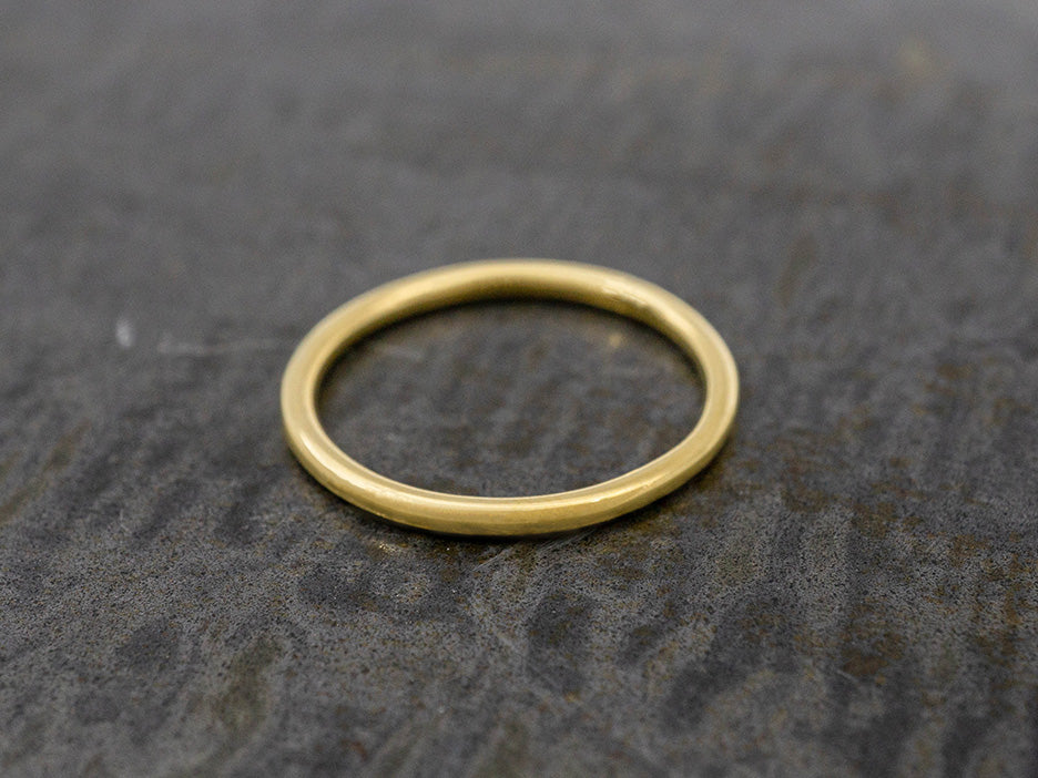 A simple, dainty gold ring.