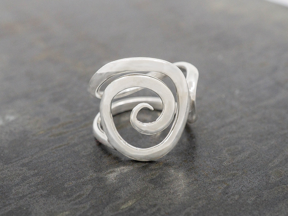 A spiral-shaped sterling silver ring.