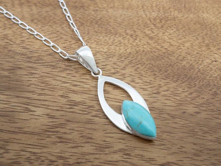 Turquoise Marquise Stone In Ribbon