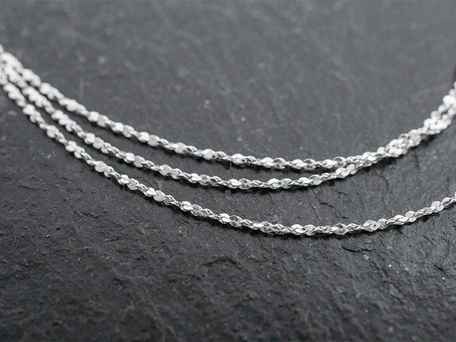 A dainty sterling silver rope cut chain.