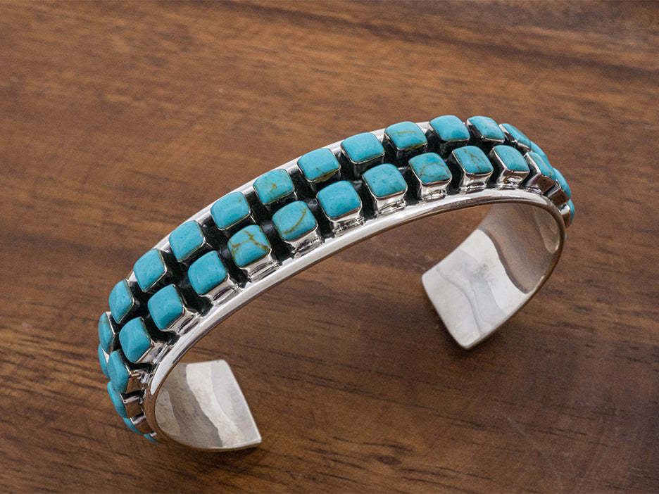 Mexican hand made sterling silver bracelet with two rows of turquoise squares.