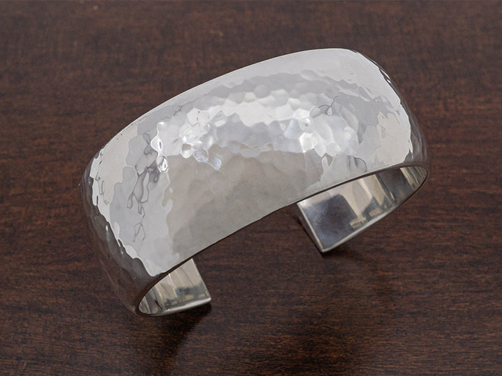 Wide, hammered sterling silver cuff bracelet.