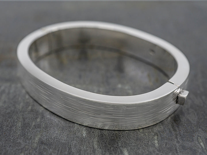 Hinged Oval Bangle w/ Raked Finish