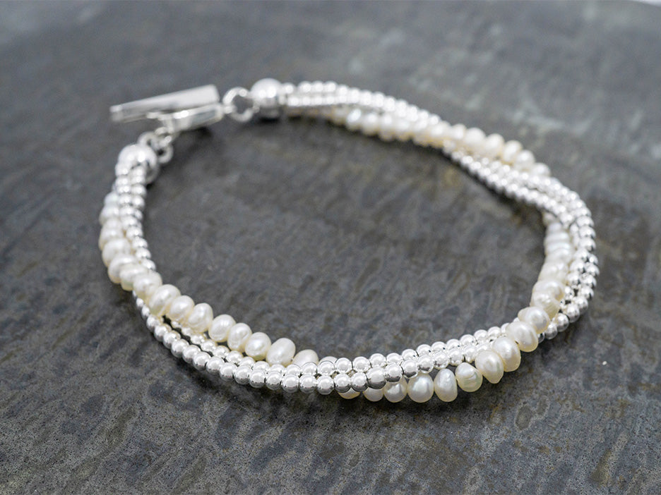 sterling silver bracelet with pearls and a decorative toggle