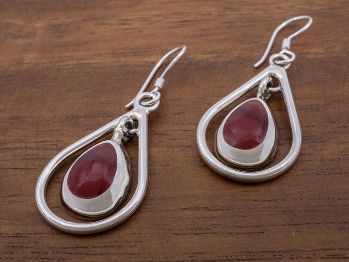 earring description: red jasper stone hanging in a sterling silver frame