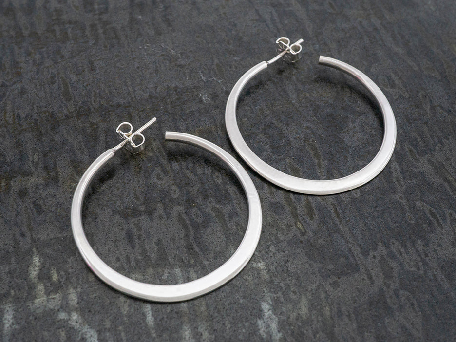 Buy Silver Plated Floral Curve Hoop Earrings by Nayaab by Aleezeh Online at  Aza Fashions.