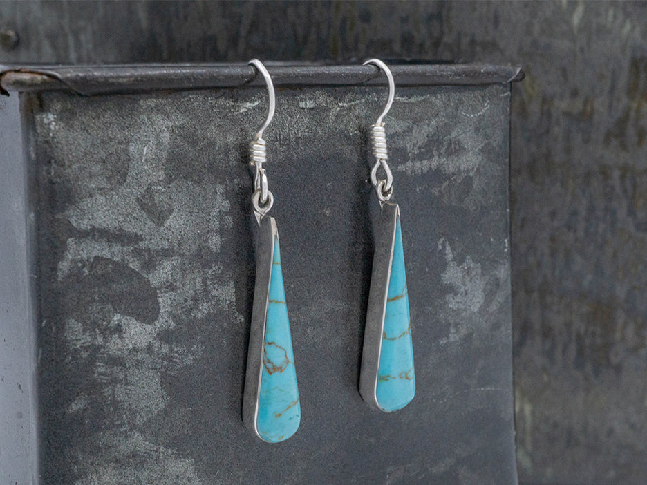 turquoise teardrop earrings set in sterling silver.