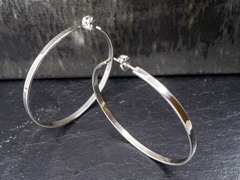 large sterling silver hoop earrings.