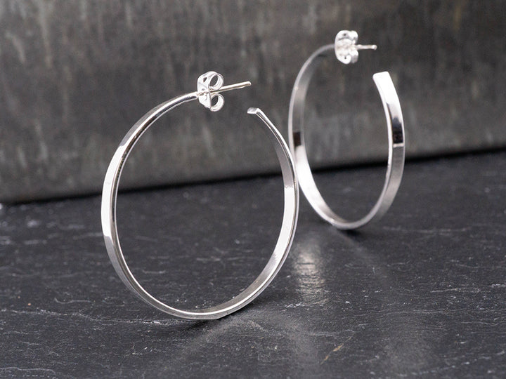 Sterling silver hoop earrings.