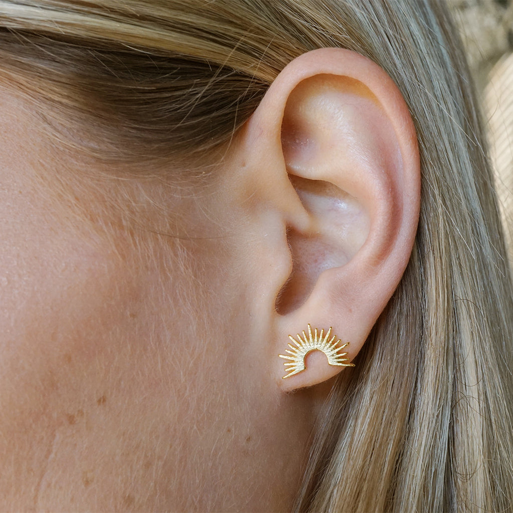 Stylized radiant half-circle stud earrings, yellow gold-filled.