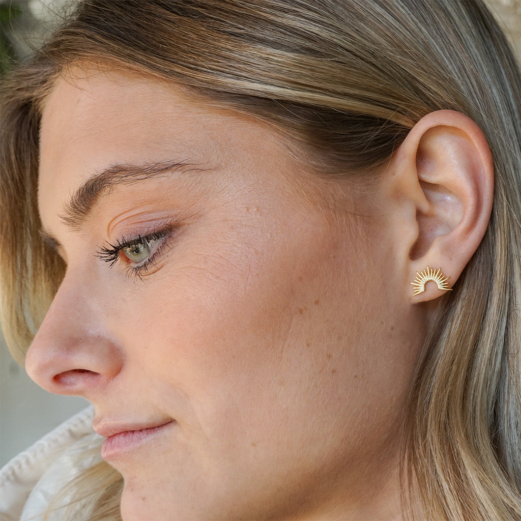 Stylized radiant half-circle stud earrings, yellow gold-filled.