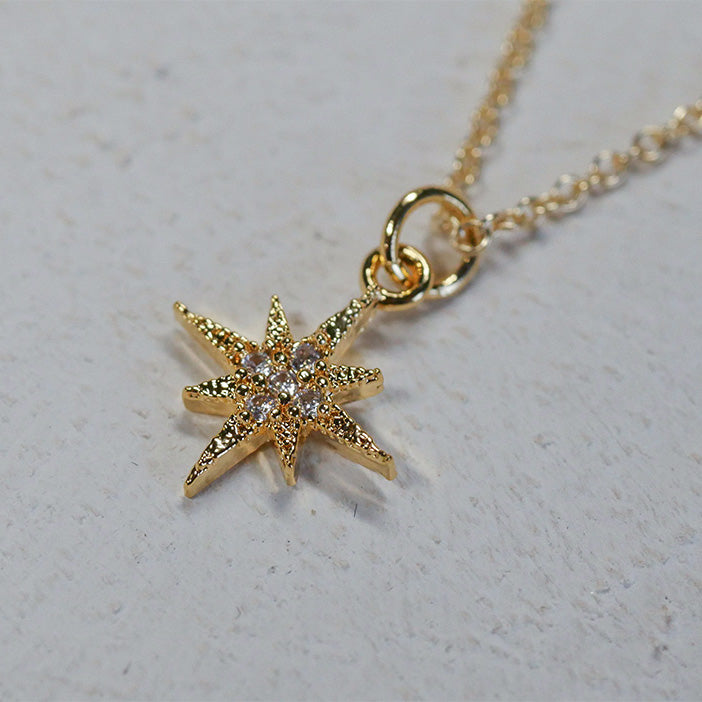 Dainty gold-filled necklace with a pave-style star pendant.