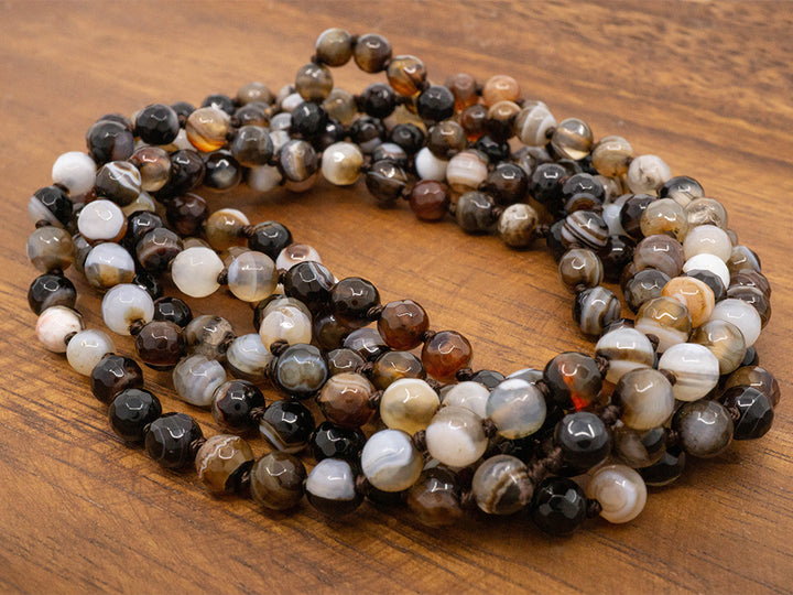 A 60" long necklace made of faceted jasper beads.