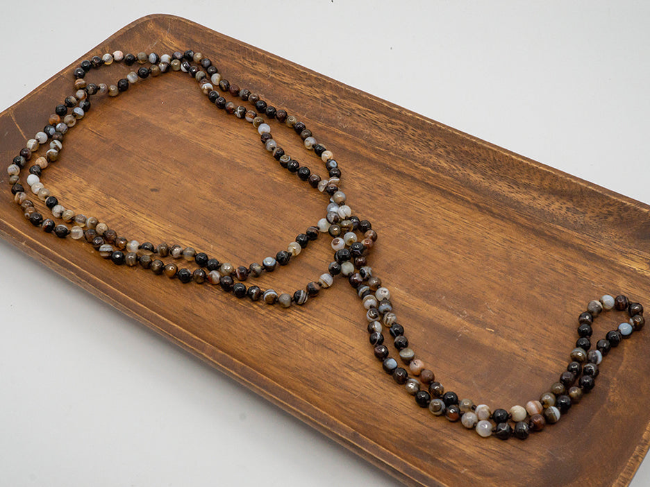 A 60" long necklace made of faceted jasper beads.