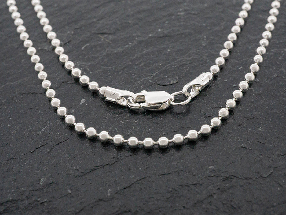A beaded sterling silver chain.