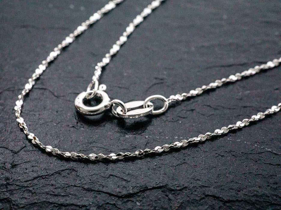 A dainty sterling silver rope cut chain.