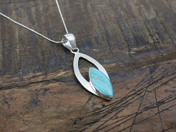 Turquoise Marquise Stone In Ribbon